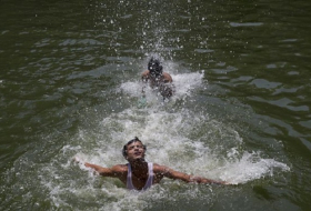 England slows down for `hottest day of the year`